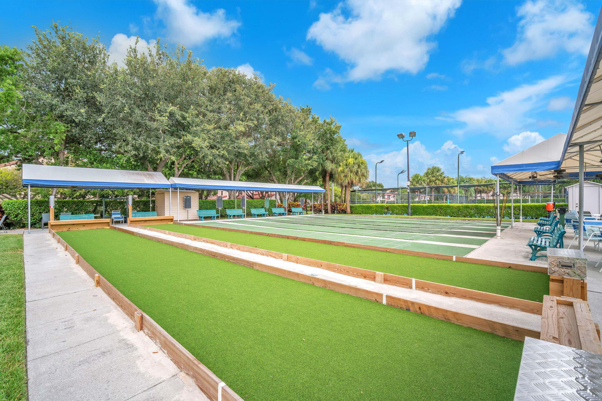 5157 Floria Way, Unit T Boynton Beach, FL 33437 - Photo 30 of 40 a view of an house with swimming pool and yard in the back