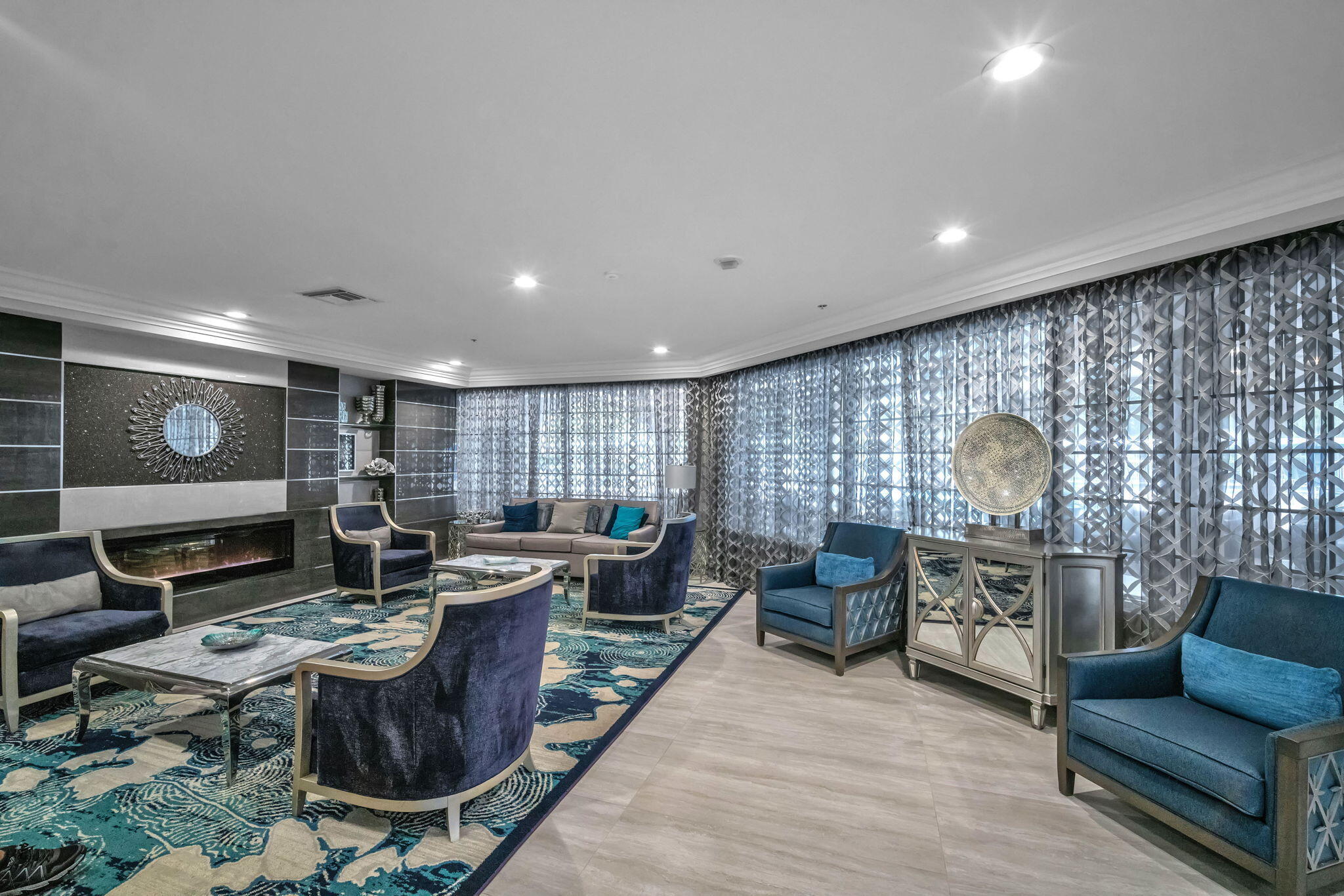 5157 Floria Way, Unit T Boynton Beach, FL 33437 - Photo 32 of 40 a living room with furniture a rug and a fireplace