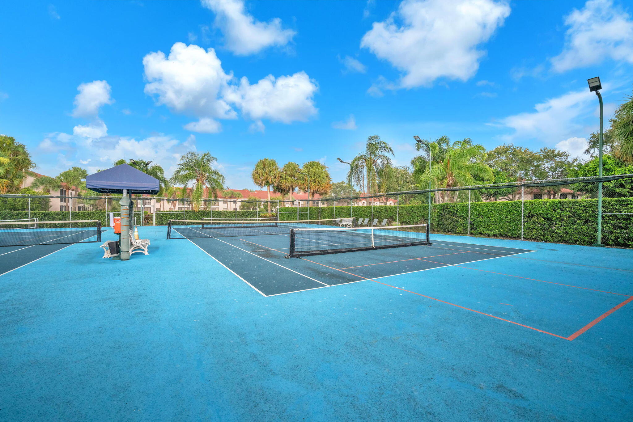 5157 Floria Way, Unit T Boynton Beach, FL 33437 - Photo 40 of 40 a view of a playground with basketball court
