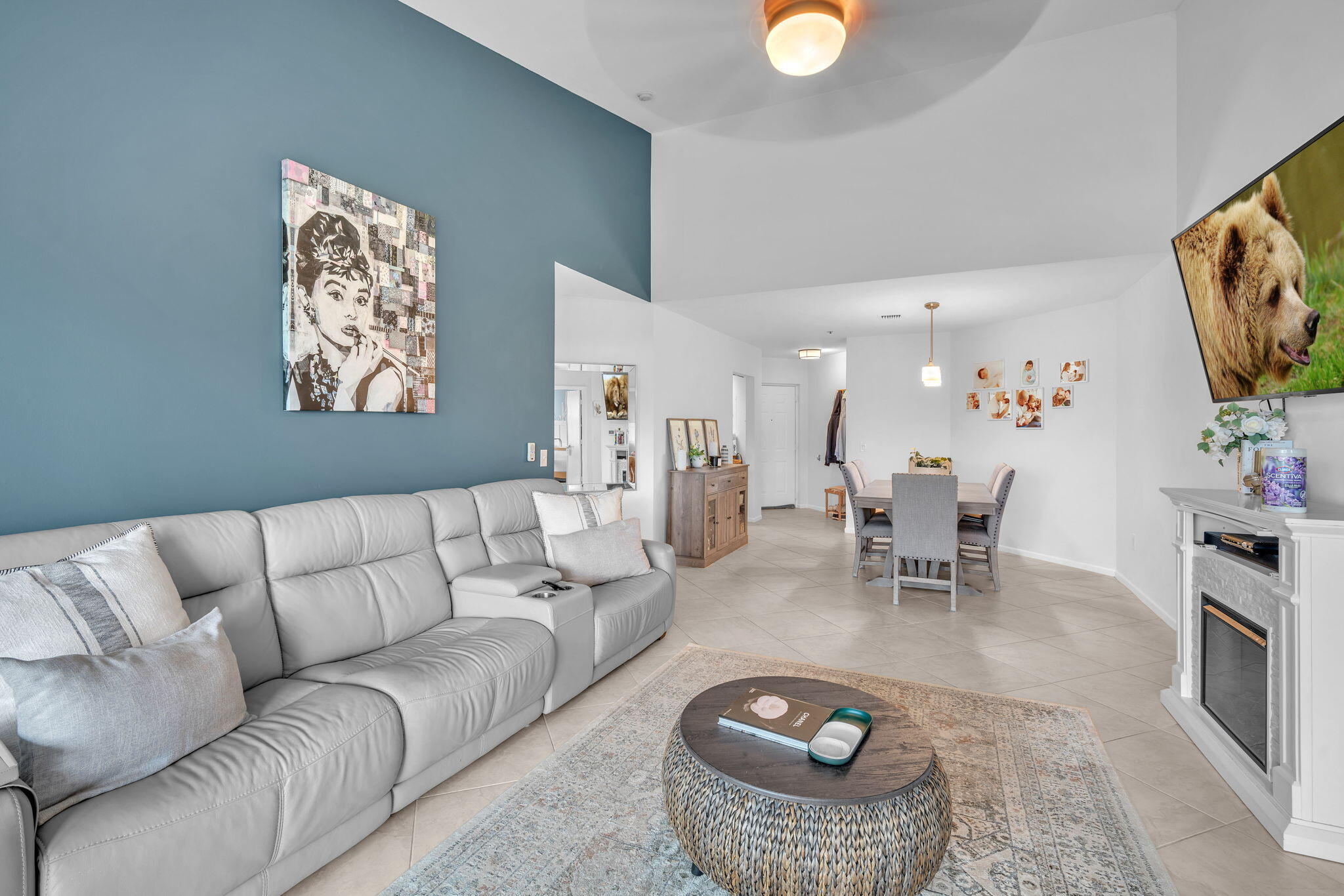 5157 Floria Way, Unit T Boynton Beach, FL 33437 - Photo 5 of 40 a living room with furniture and a chandelier