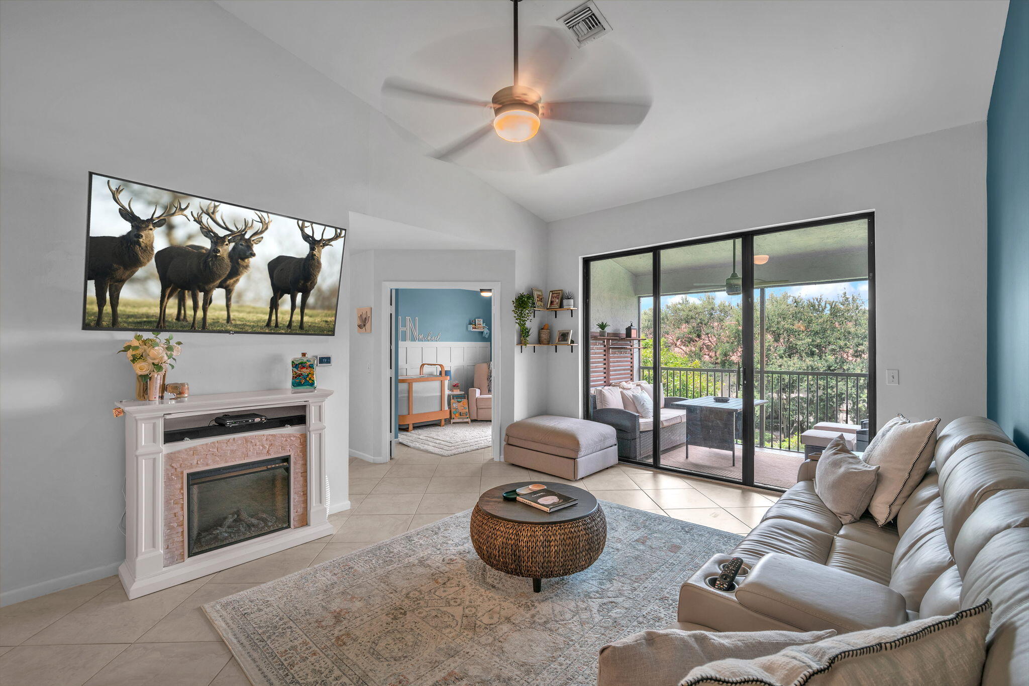 5157 Floria Way, Unit T Boynton Beach, FL 33437 - Photo 7 of 40 a living room with furniture and a fireplace