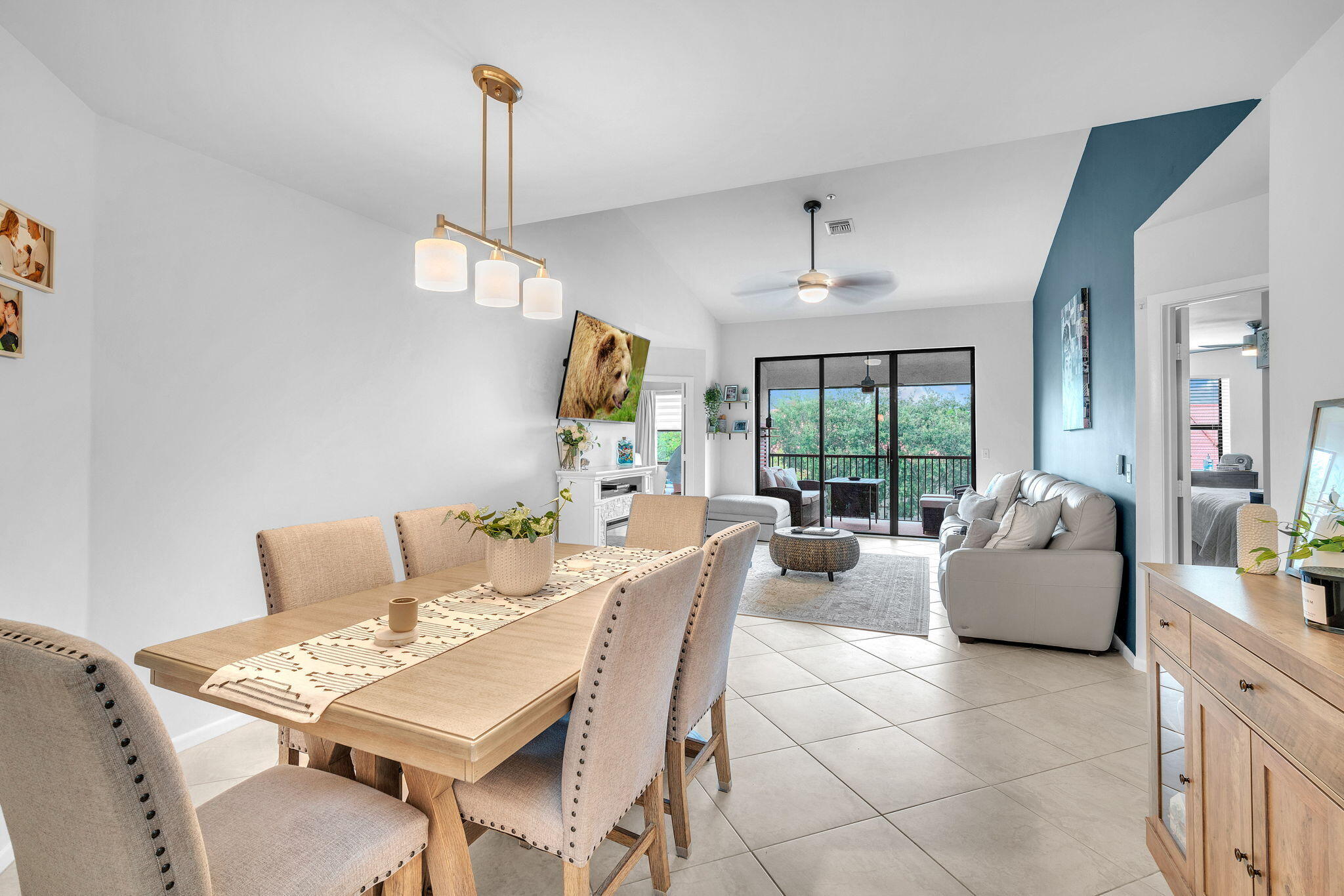 5157 Floria Way, Unit T Boynton Beach, FL 33437 - Photo 9 of 40 a living room with furniture a window and a chandelier