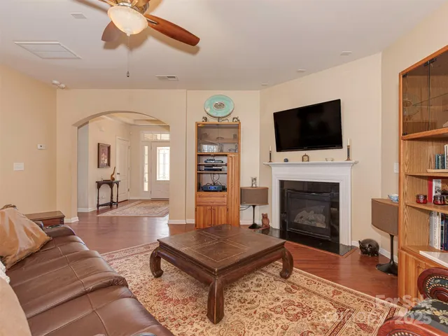 a kitchen with kitchen island granite countertop a sink counter top space appliances and cabinets