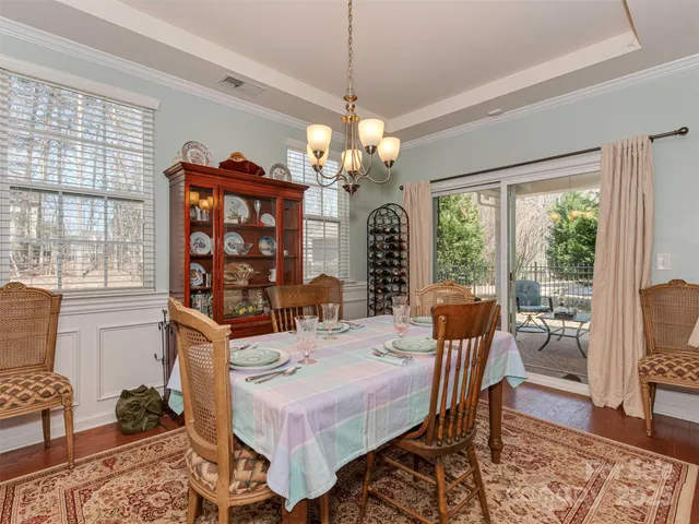 a kitchen with stainless steel appliances granite countertop sink stove and wooden floor
