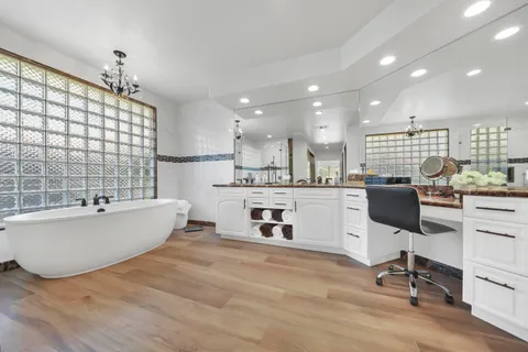 a swimming pool with outdoor seating and yard