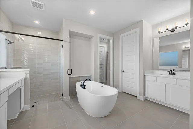 a bathroom with a bathtub and a sink