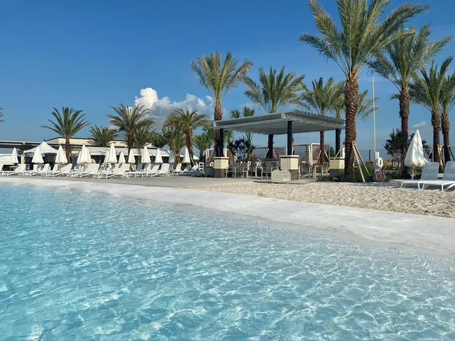 an aerial view of a swimming pool patio and ocean view