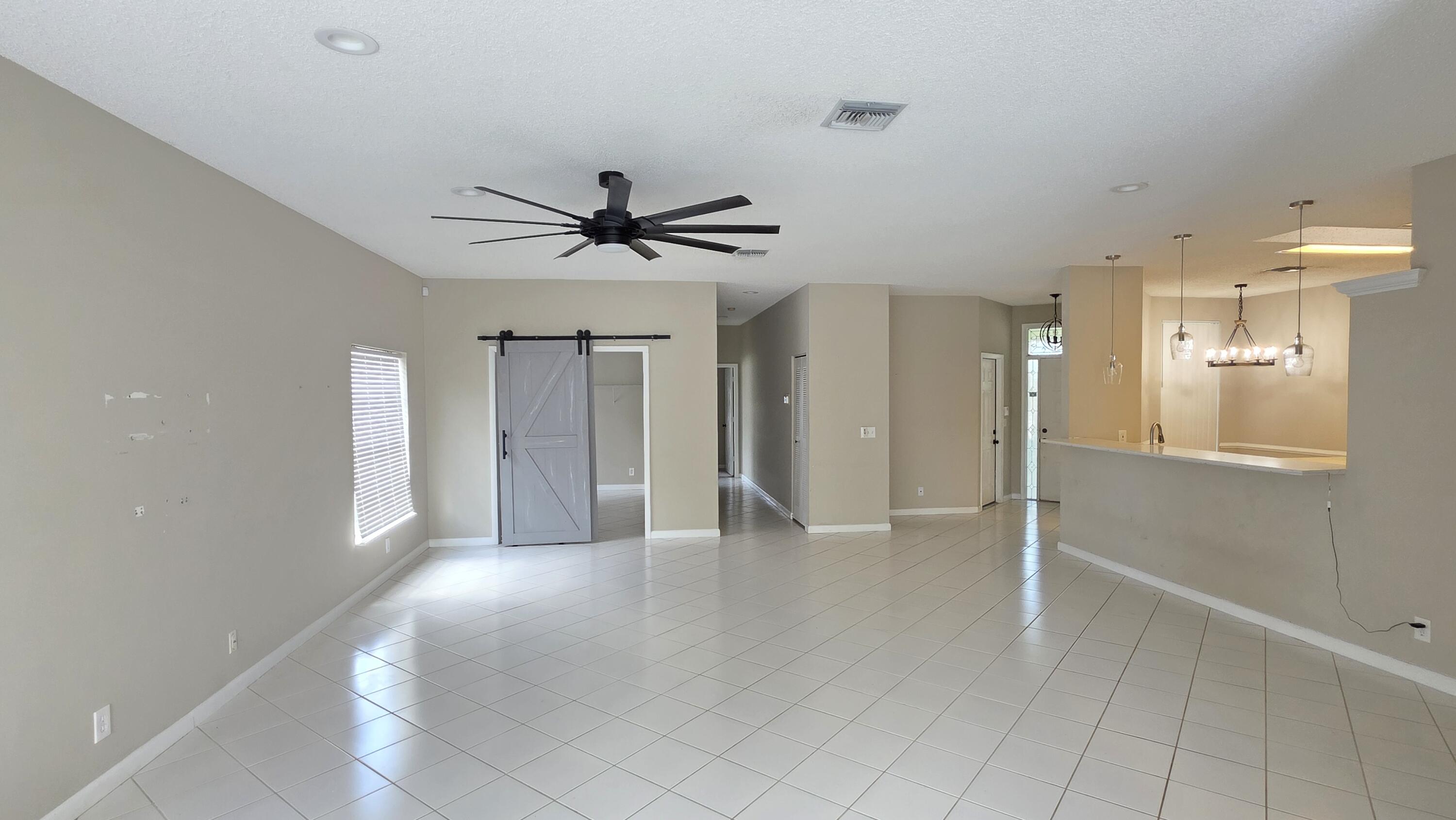 7769 Mansfield Hollow Road Delray Beach, FL 33446 - Photo 13 of 27 a view of an empty room with a window