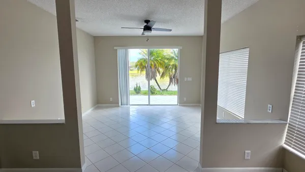 an empty room with windows and yard
