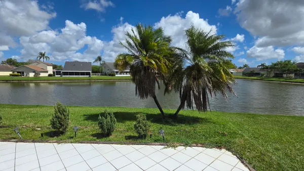 a view of a lake with a yard