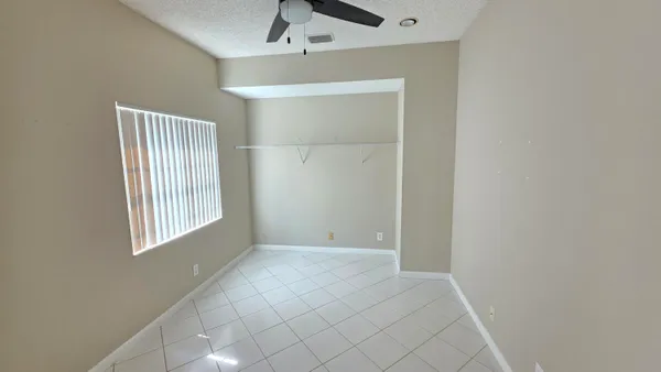 a view of an empty room with windows
