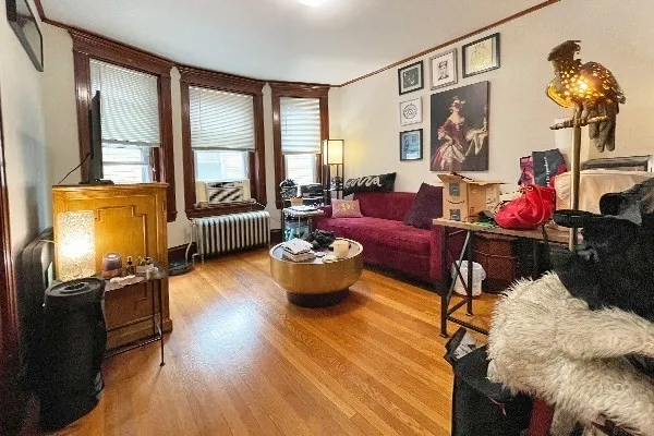 a living room with furniture or couch and a window