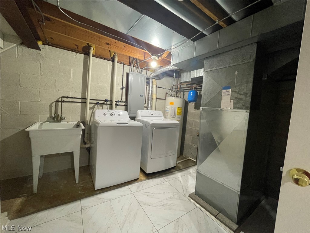 6577 Engle Road, Unit 41D Brook Park, OH 44142 - Photo 23 of 32 Laundry room with water heater, washer hookup, separate washer and dryer, and light tile floors