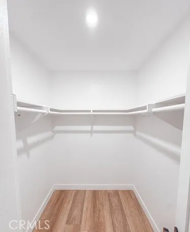 a kitchen with kitchen island a stove a refrigerator and a sink