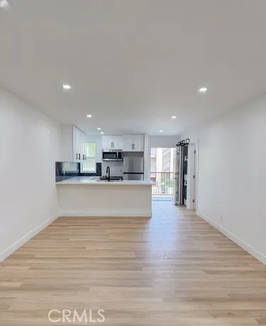 a view of kitchen and kitchen with furniture
