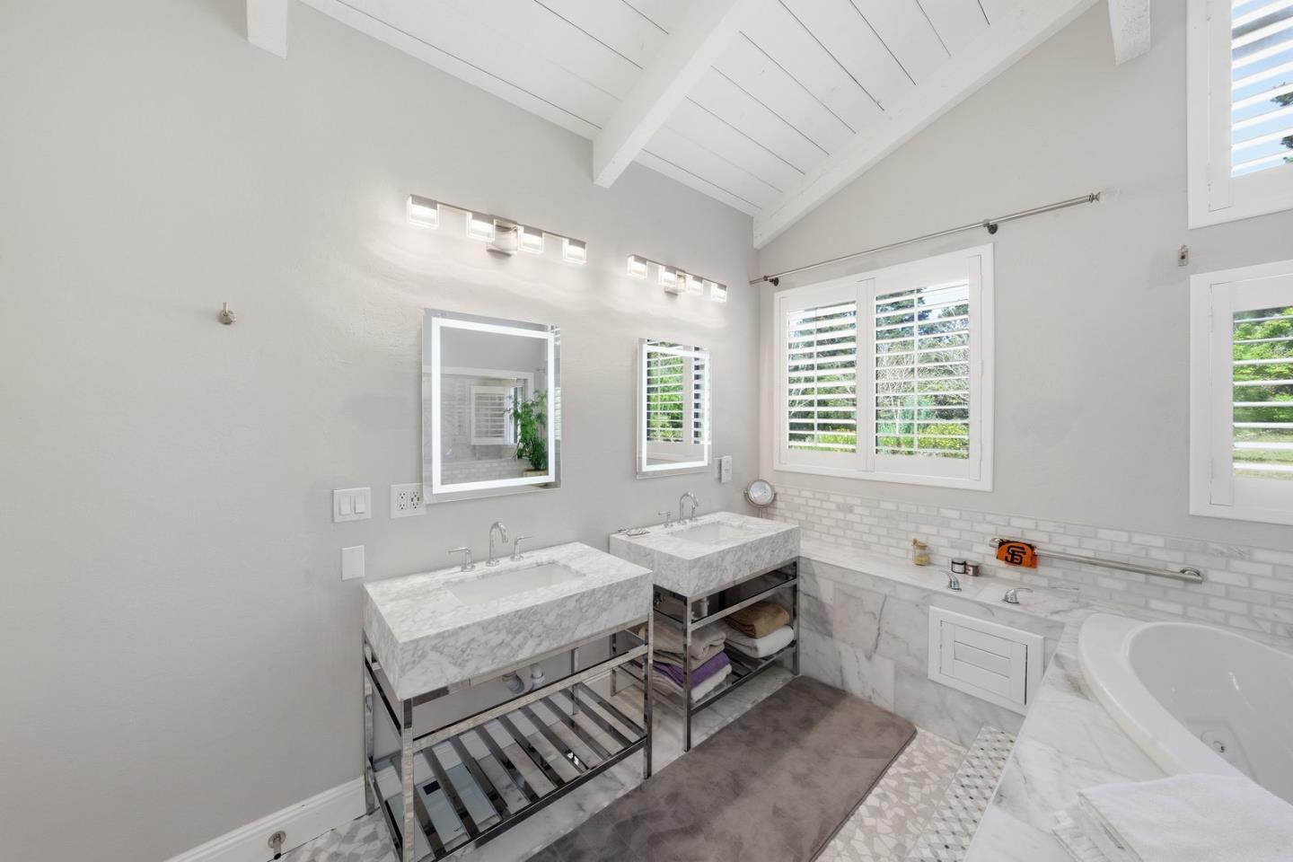 701 Day Valley Road Aptos, CA 95003 - Photo 20 of 43 a spacious bathroom with a granite countertop tub sink and mirror
