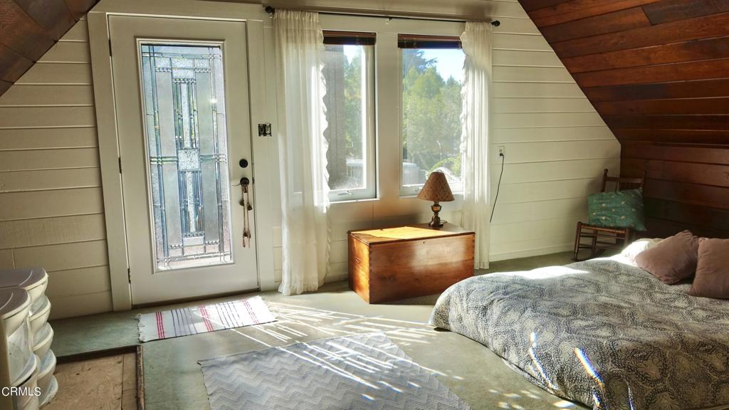 31421 State Highway 20 Fort Bragg, CA 95437 - Photo 11 of 28 a bedroom with a bed and a window