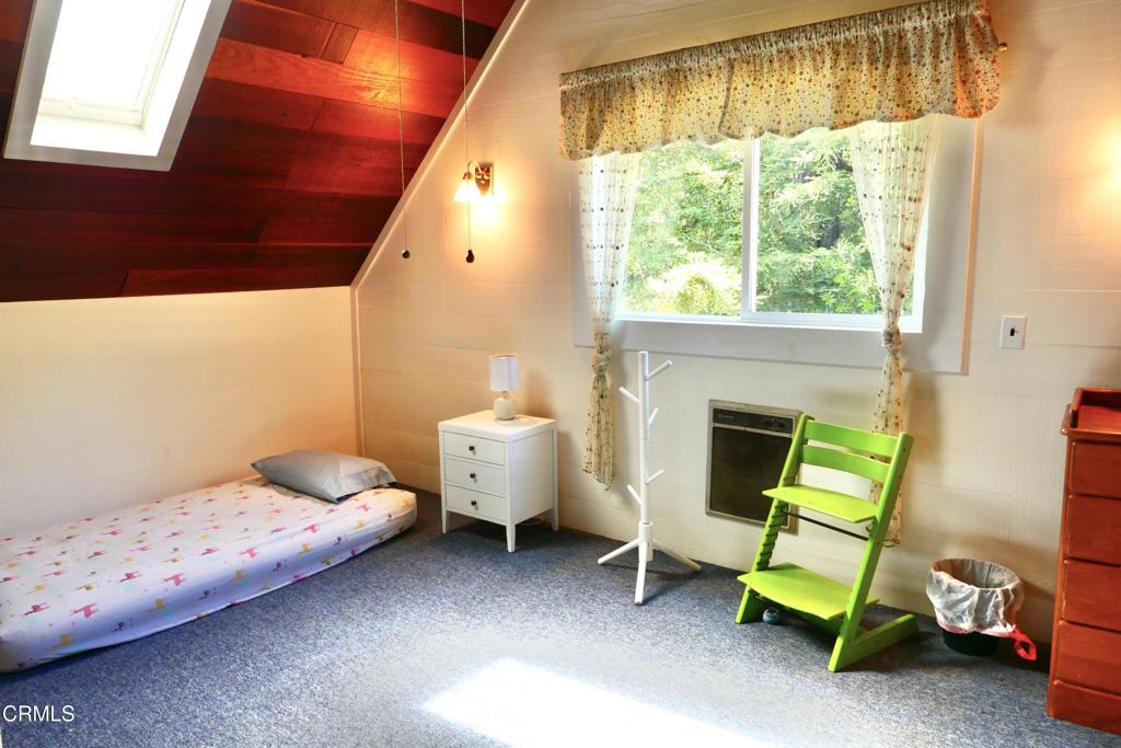 31421 State Highway 20 Fort Bragg, CA 95437 - Photo 13 of 28 a bedroom with a bed and a fireplace