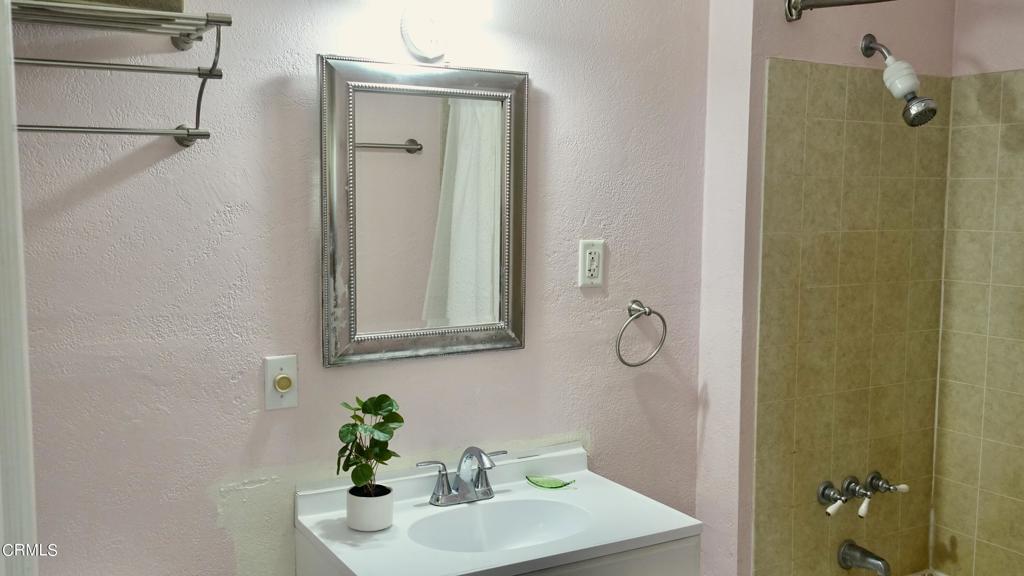 31421 State Highway 20 Fort Bragg, CA 95437 - Photo 17 of 28 a bathroom with a shower sink and mirror