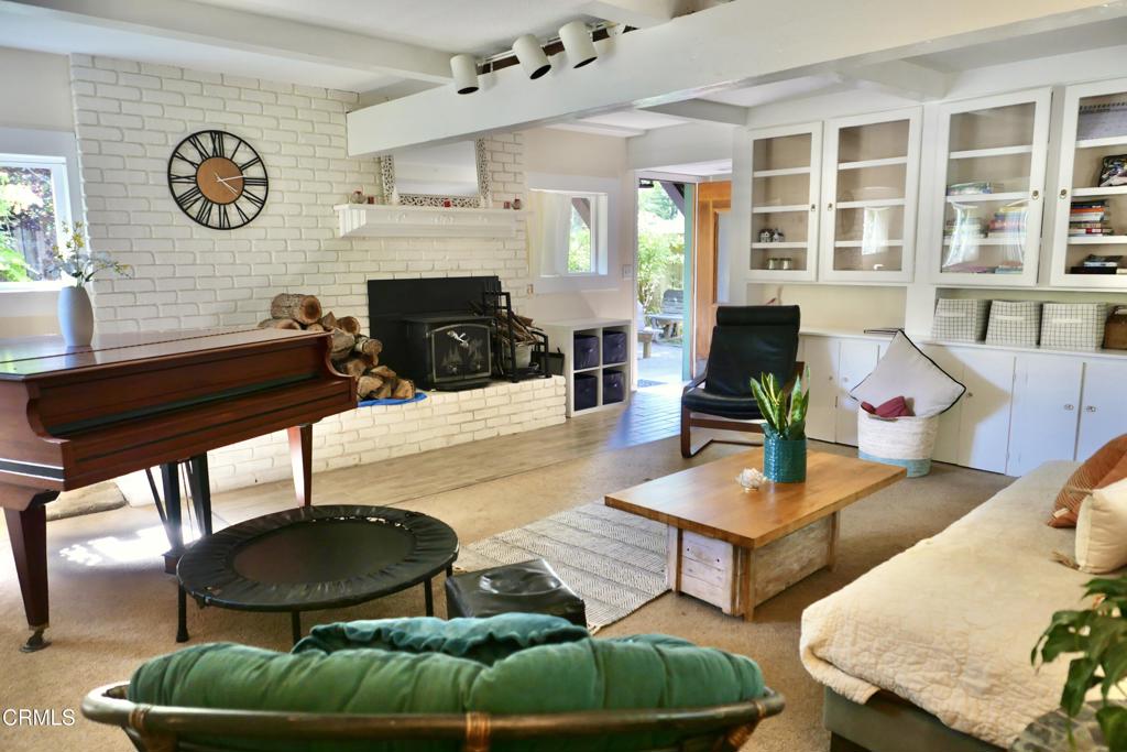 31421 State Highway 20 Fort Bragg, CA 95437 - Photo 5 of 28 a living room with furniture a rug and wall paintings