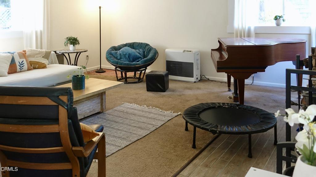 31421 State Highway 20 Fort Bragg, CA 95437 - Photo 7 of 28 a living room with furniture a rug and a chandelier