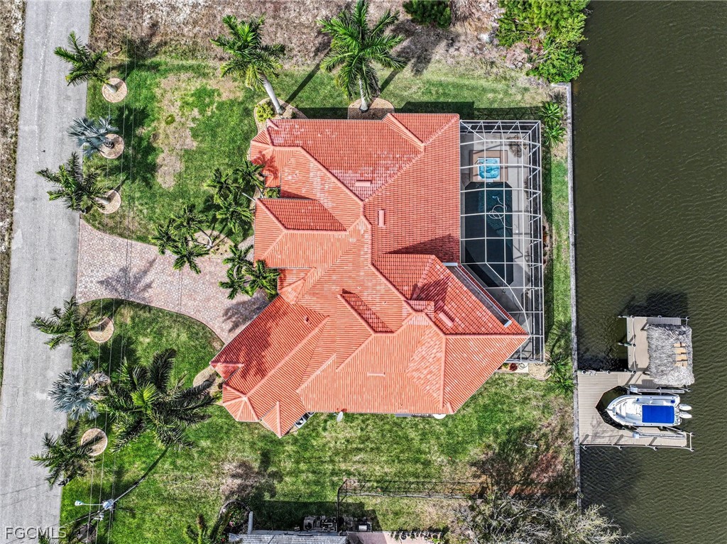 an aerial view of a house with outdoor space