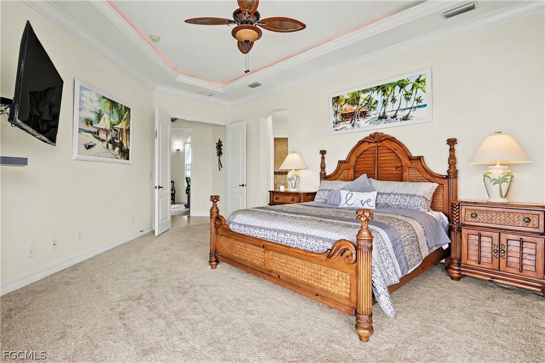 4113 Northwest 26th Street Cape Coral, FL 33993 - Photo 15 of 37 a bed room with a bed and a television