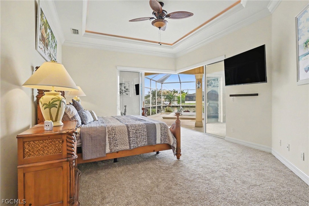 4113 Northwest 26th Street Cape Coral, FL 33993 - Photo 16 of 37 a bed room with a bed television and a window