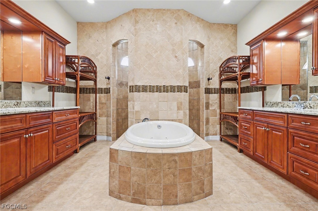4113 Northwest 26th Street Cape Coral, FL 33993 - Photo 17 of 37 a bathroom with a sink double vanity and a mirror