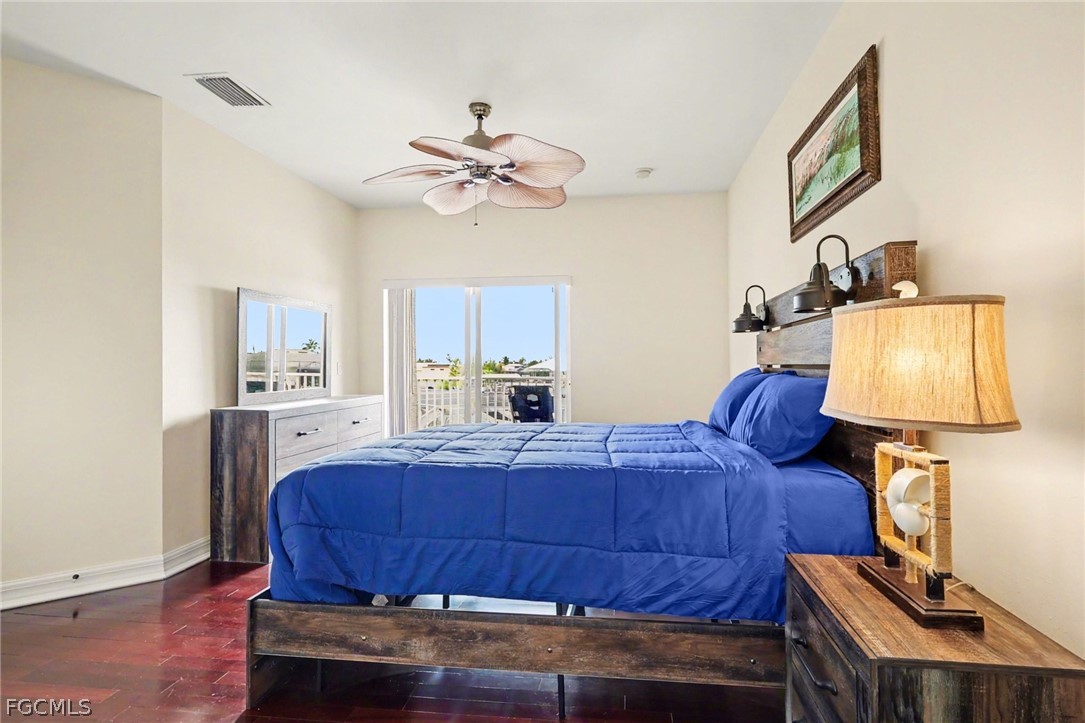 4113 Northwest 26th Street Cape Coral, FL 33993 - Photo 19 of 37 a bedroom with a bed and wooden floor