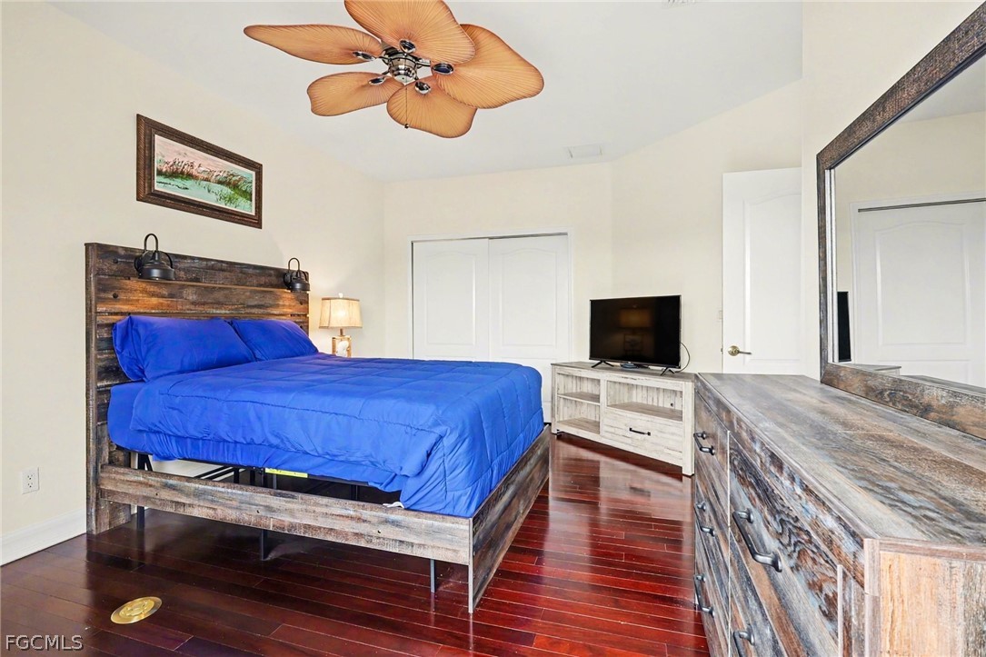 4113 Northwest 26th Street Cape Coral, FL 33993 - Photo 20 of 37 a bedroom with a bed and a flat screen tv