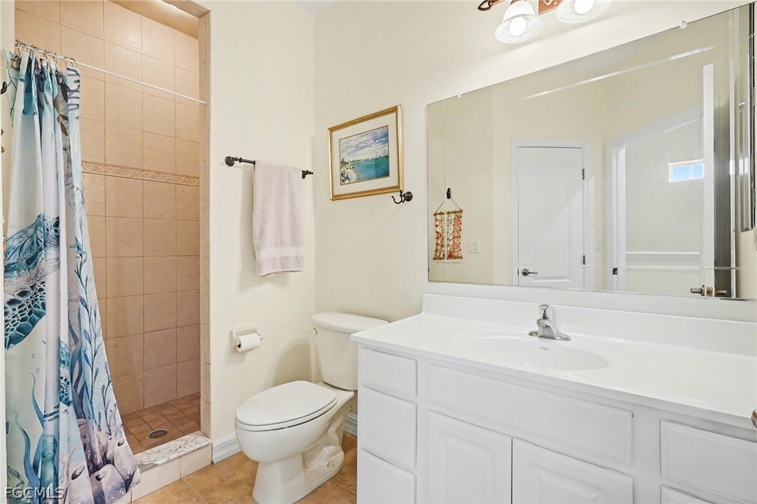4113 Northwest 26th Street Cape Coral, FL 33993 - Photo 24 of 37 a bathroom with a sink toilet and shower