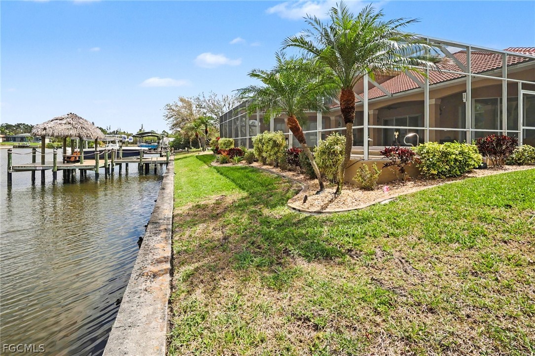 4113 Northwest 26th Street Cape Coral, FL 33993 - Photo 31 of 37 a view of a swimming pool and lounge chairs