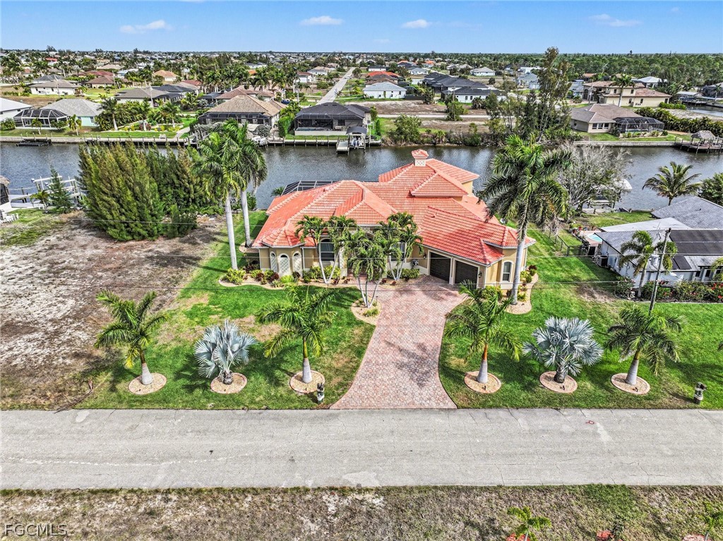 4113 Northwest 26th Street Cape Coral, FL 33993 - Photo 33 of 37 an aerial view of residential houses with outdoor space and river