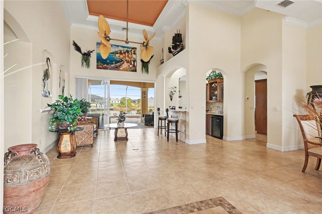 4113 Northwest 26th Street Cape Coral, FL 33993 - Photo 5 of 37 a view of a living room and dining room