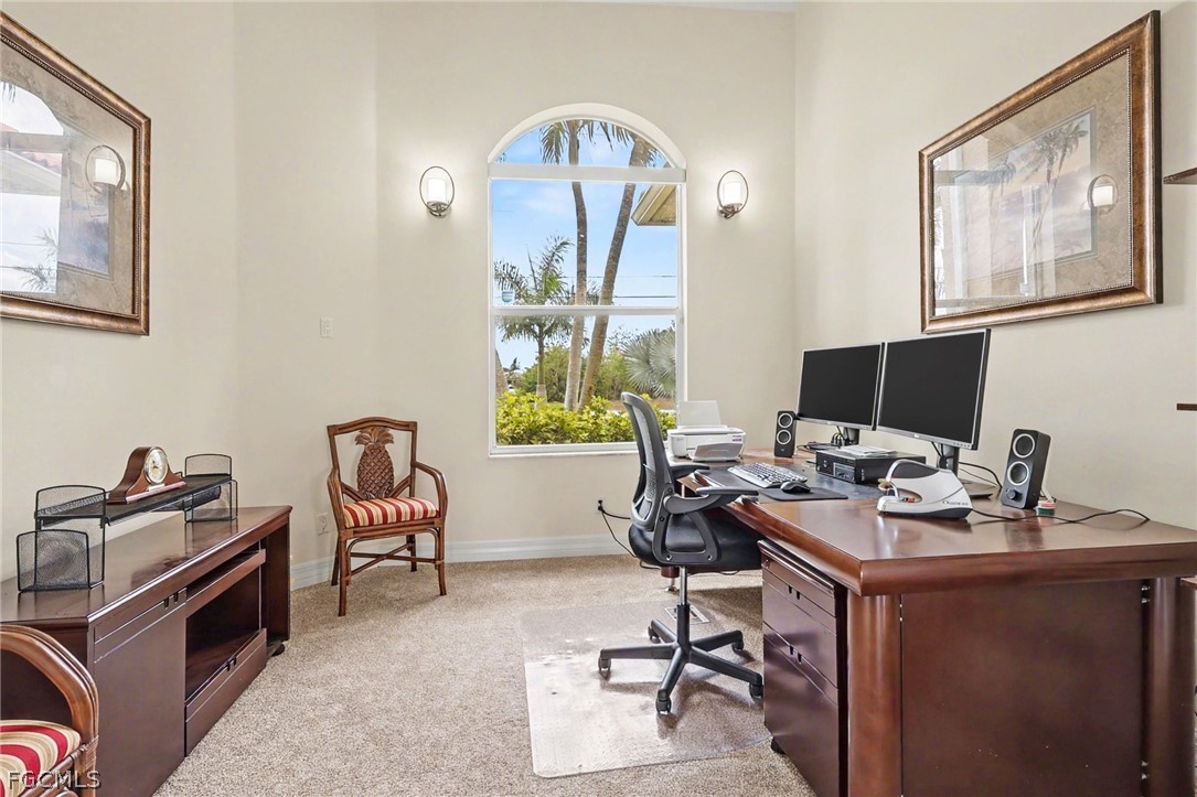 4113 Northwest 26th Street Cape Coral, FL 33993 - Photo 8 of 37 a view of a workspace with furniture and a window