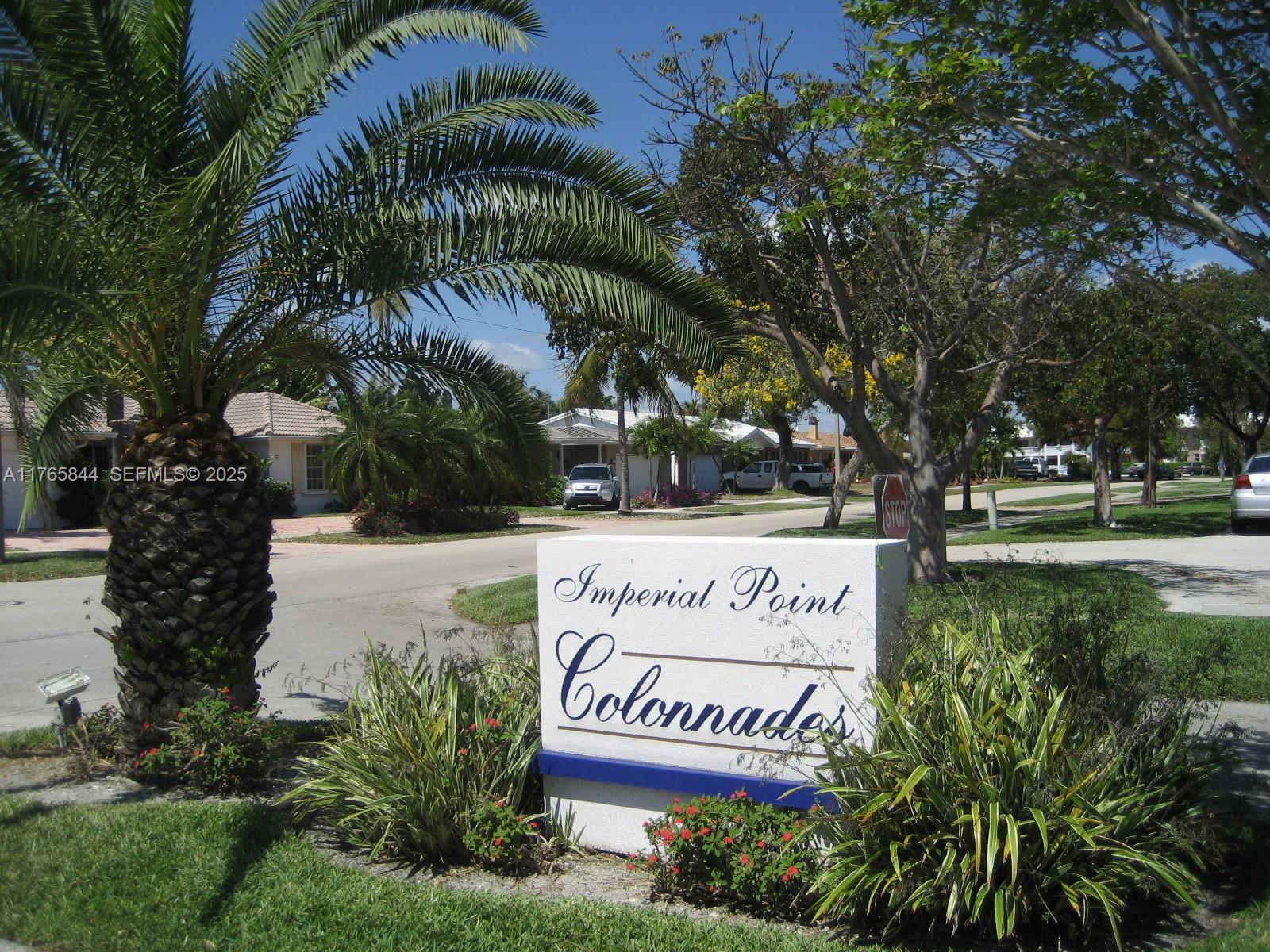 2201 Northeast 66th Street, Unit 1301 Fort Lauderdale, FL 33308 - Photo 15 of 23 a sign on a sidewalk next to a road