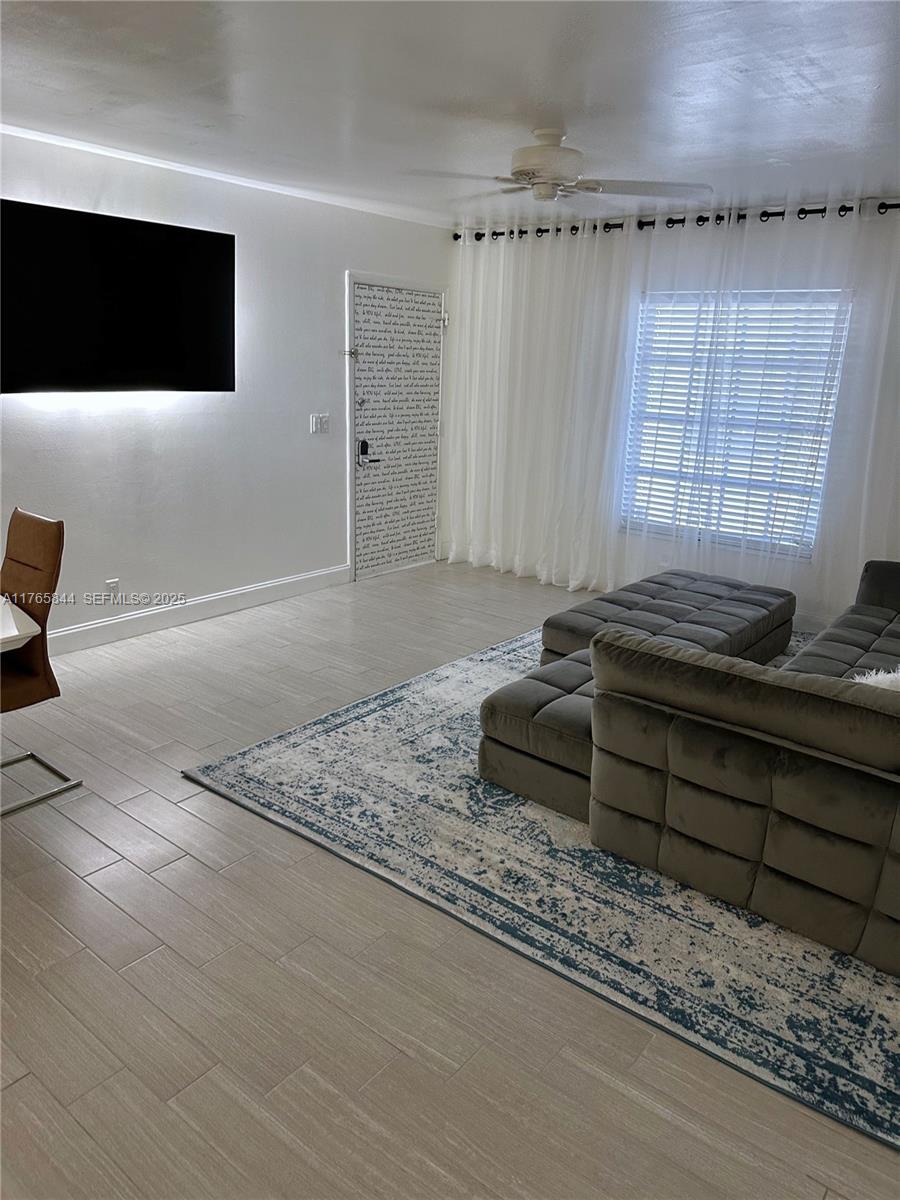 2201 Northeast 66th Street, Unit 1301 Fort Lauderdale, FL 33308 - Photo 3 of 23 a bedroom with a bed and a flat screen tv