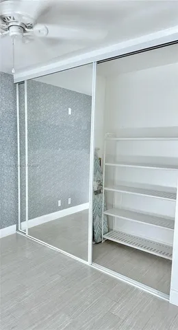 a view of an empty room with a bathroom