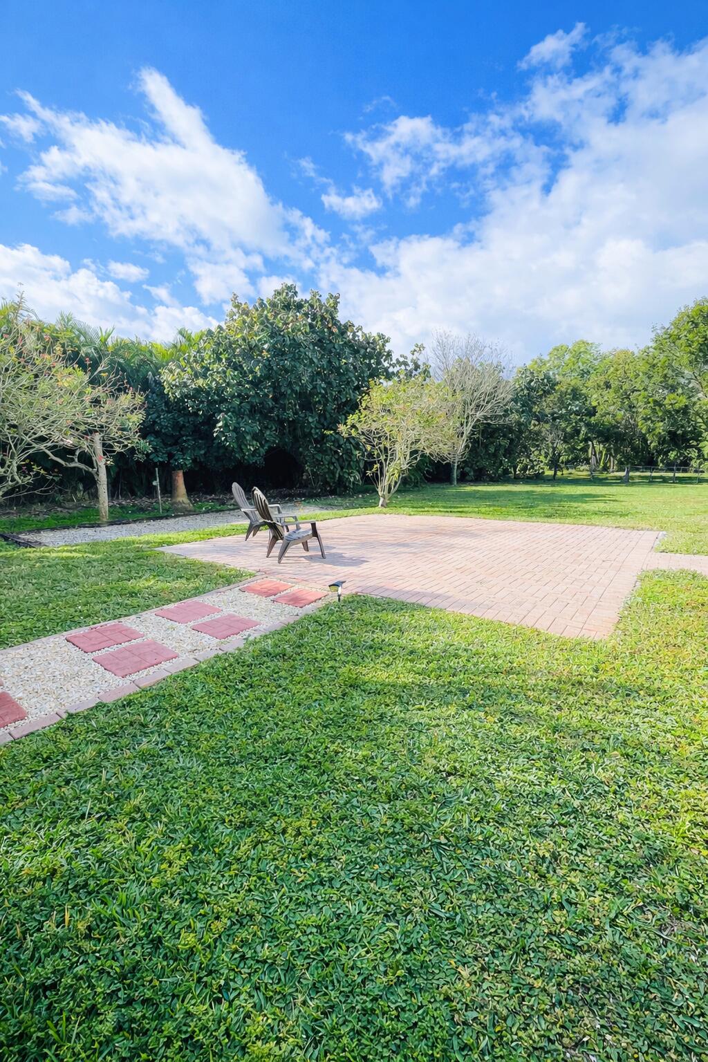 13218 86th Road North West Palm Beach, FL 33412 - Photo 38 of 40 a view of a golf course with a lake