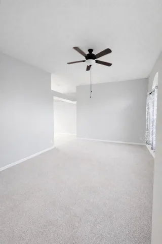 a view of a livingroom with a ceiling fan