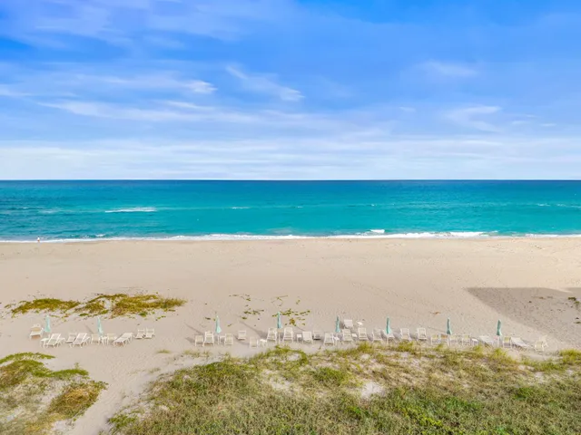 a view of an ocean beach and mountain