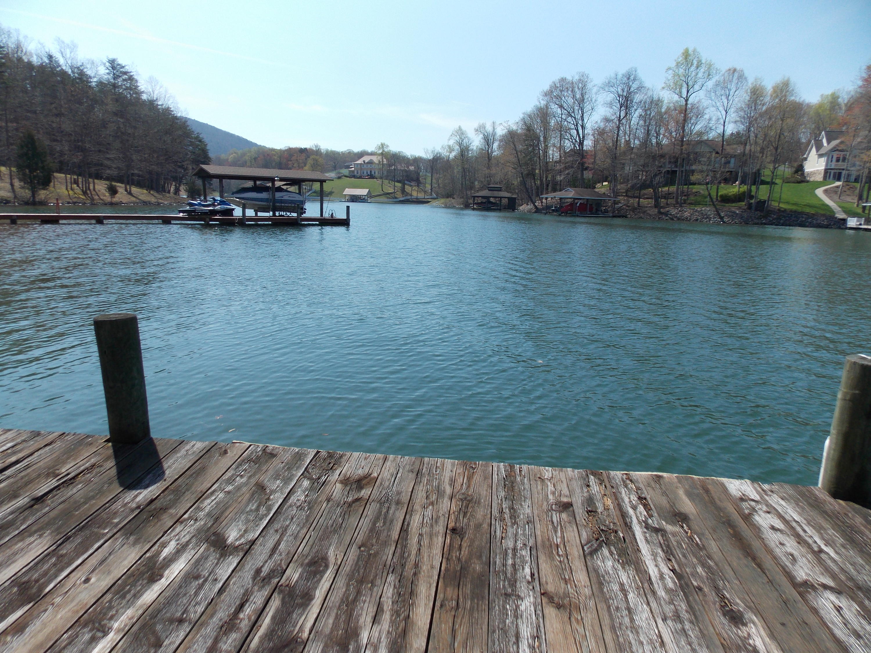 356 Cool Branch Road Penhook, VA 24137 - Photo 18 of 40 a view of a lake with houses