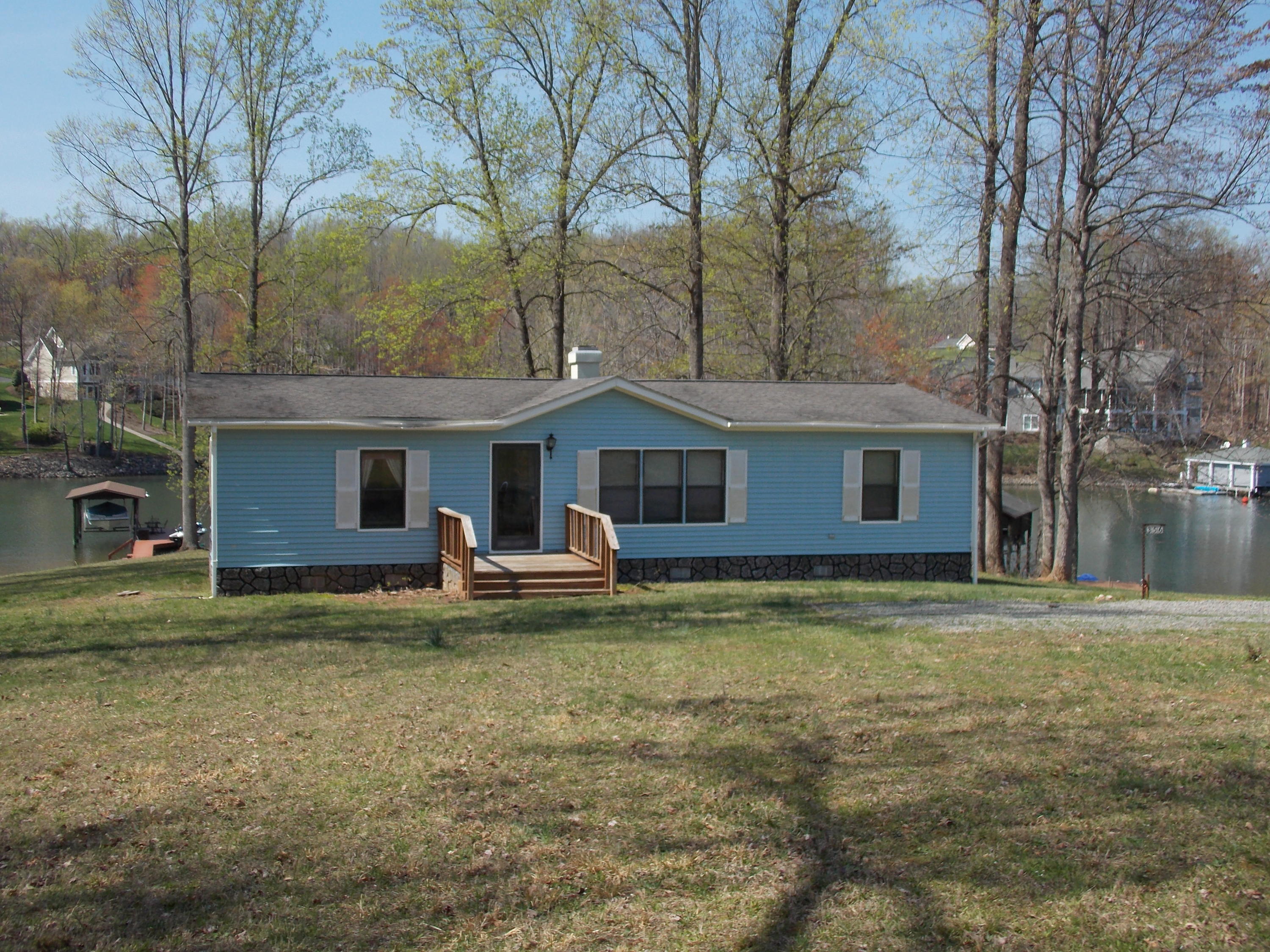 356 Cool Branch Road Penhook, VA 24137 - Photo 3 of 40 a view of a house with a yard and large tree
