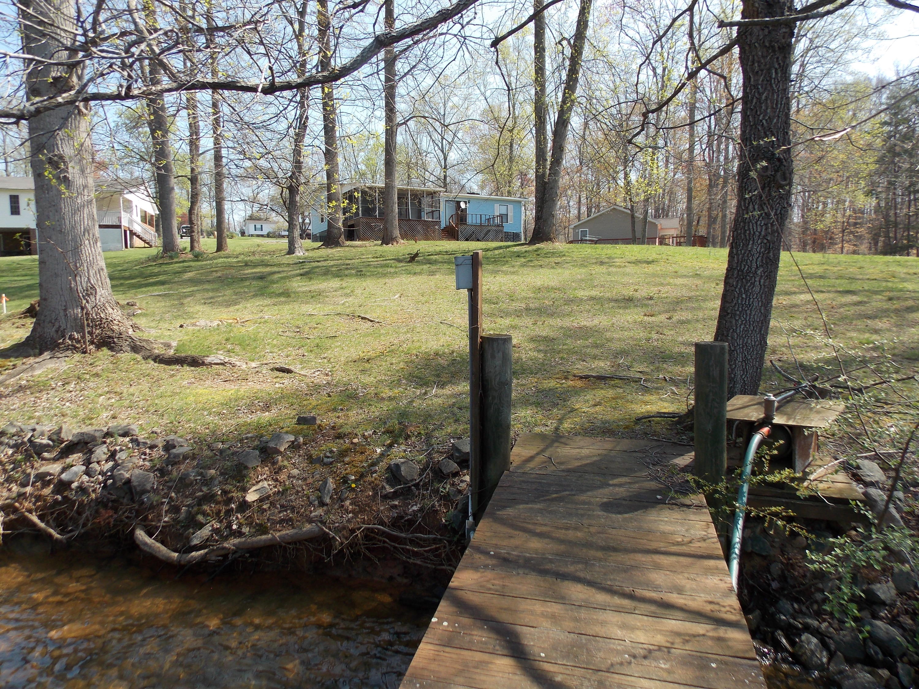 356 Cool Branch Road Penhook, VA 24137 - Photo 21 of 40 a view of a yard with large trees