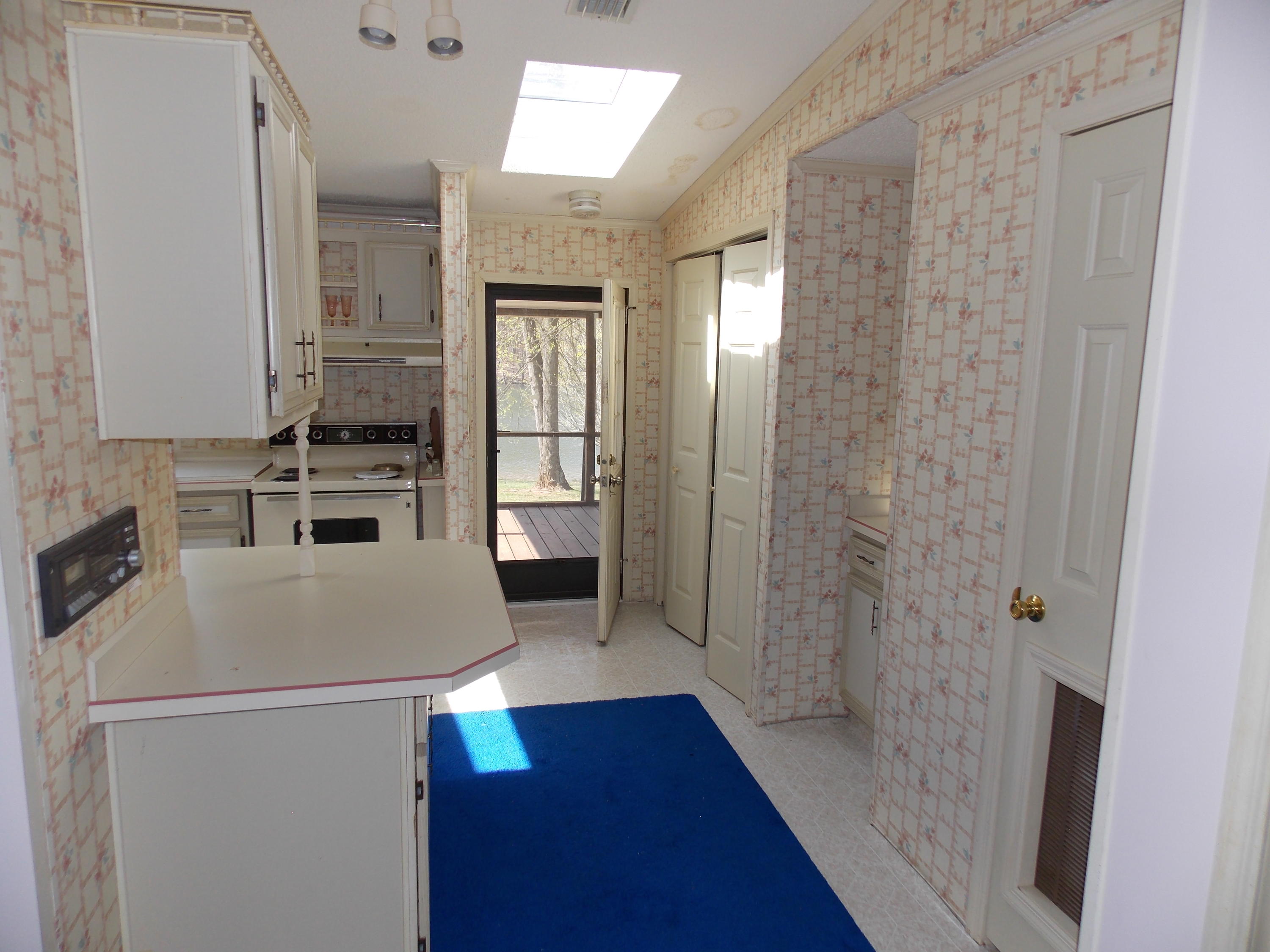 356 Cool Branch Road Penhook, VA 24137 - Photo 29 of 40 a kitchen with a refrigerator a sink and dishwasher