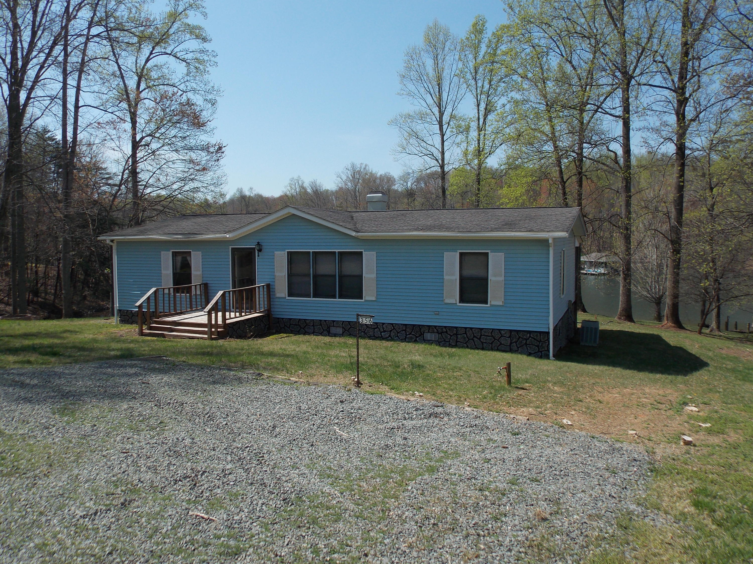 356 Cool Branch Road Penhook, VA 24137 - Photo 4 of 40 a view of a house with a yard and large tree