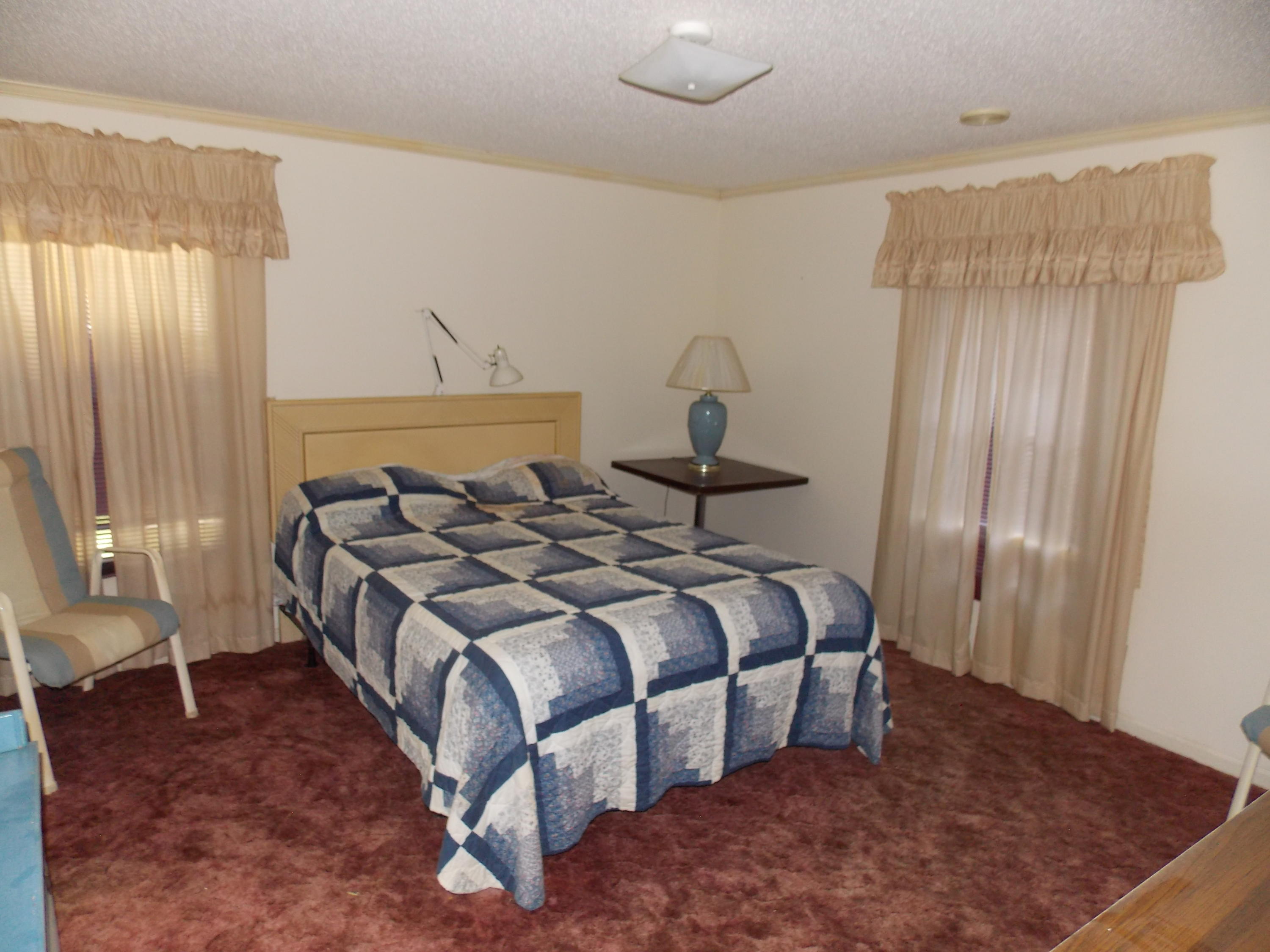 356 Cool Branch Road Penhook, VA 24137 - Photo 32 of 40 a bedroom with a bed and window