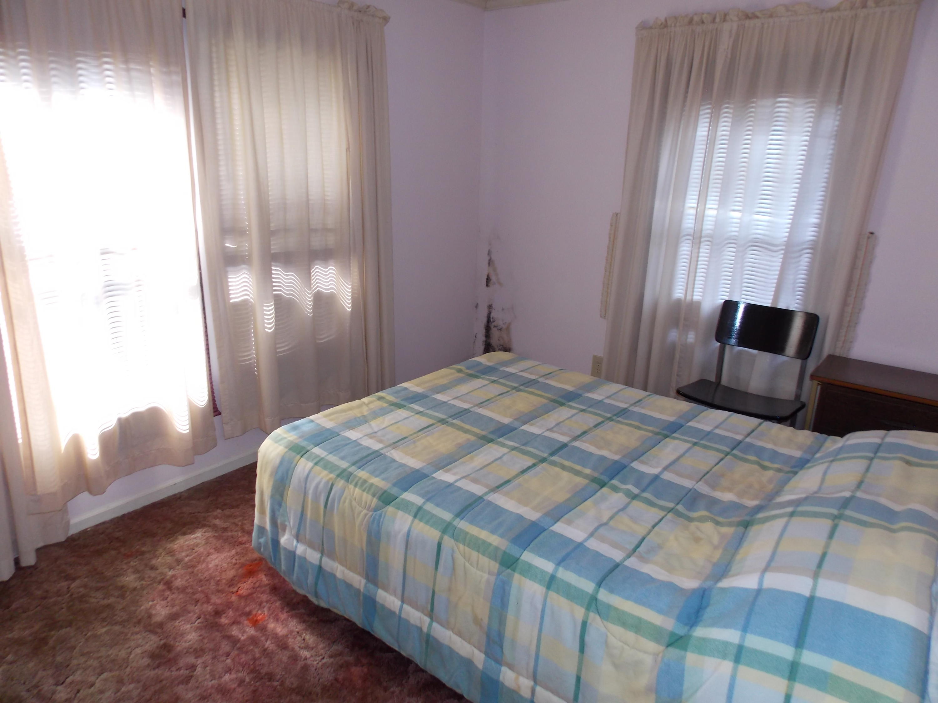 356 Cool Branch Road Penhook, VA 24137 - Photo 38 of 40 a bedroom with a bed and a mirror