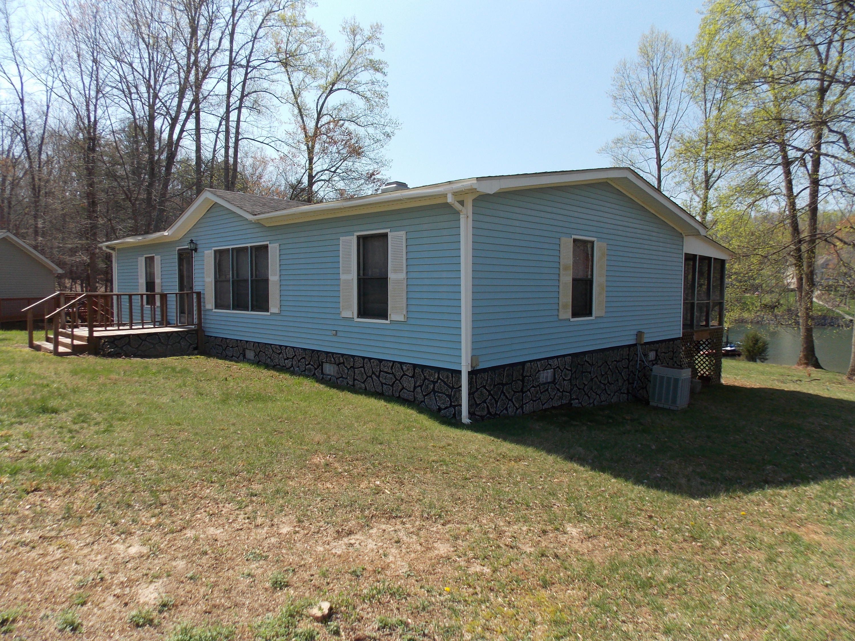 356 Cool Branch Road Penhook, VA 24137 - Photo 6 of 40 a house view with a garden space